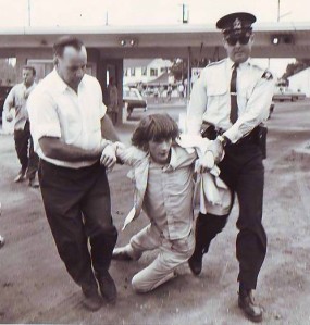 Peter Kormos being dragged away by police at a 1960s protest for public access to our lakeshores at Sherkston Beach on Lake Erie.  - from the photo collection of Peter Kormos