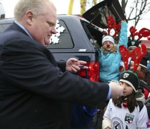 Toronto Mayor Rob Fords hands out candy canes to children at a Santa Claus parade in the city. There were apparently a few boos, but most Torontians still love him for his crusade to cut their taxes, etc.